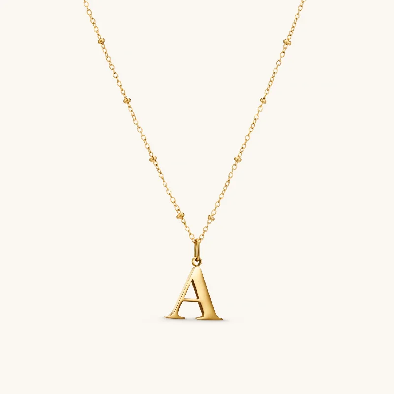 A Initial Pendant Necklace In Gold